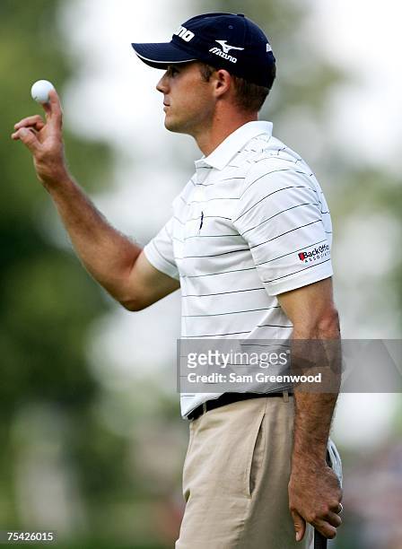 Jonathan Byrd waves with his ball to the crowd on the 18th hole during the final round of the John Deere Classic at the TPC Deere Run July 15, 2007...