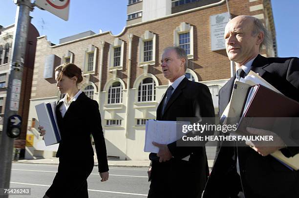 Government prosecutors led by Clive Porritt arrive at the Magistrates court in Brisbane, 16 July 2007, for the bail hearing of arrested Indian doctor...