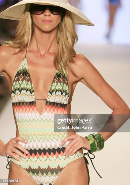 Model walks down the runway at the Jessica Simpson swimwear fashion show during "Mercedes Benz Fashion Week: Miami Swim" in the Cabana Grande tent at...