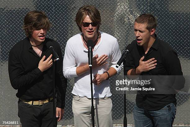 Pop rock band The Hanson Brothers, Zachary, Jordan and Isaac Hanson, sing the National Anthem before the start of the NASCAR Nextel Cup Series USG...