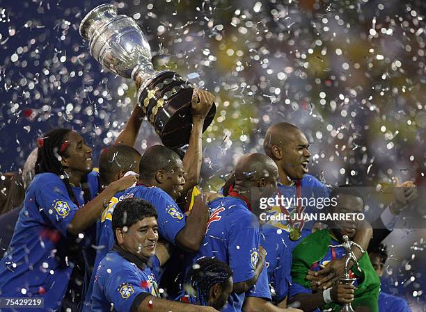 Brazilian players celebrate their victory against Argentina at the end of the 42nd Copa America Venezuela-2007 final match at the Pachencho Romero...