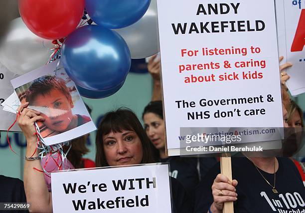 Supporters of gastroenterologist Dr Andrew Wakefield hold placards outside the GMC on July 16, 2007 on London, England. Wakefield is appearing before...
