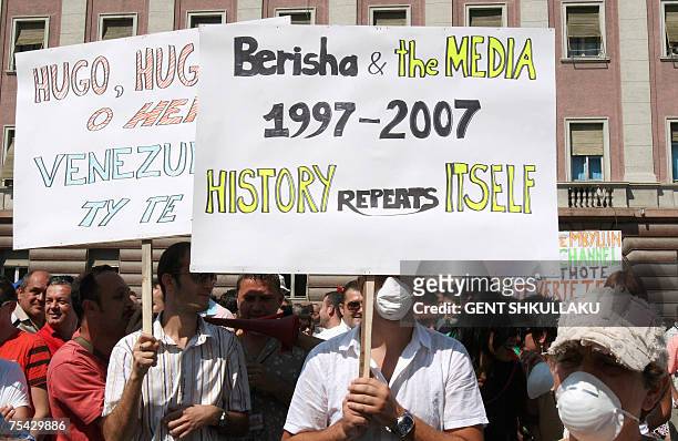 Journalists and employees of Top Channel, an Albanian private broadcaster, protest in front of a government building in Tirana, 16 July 2007. Last...