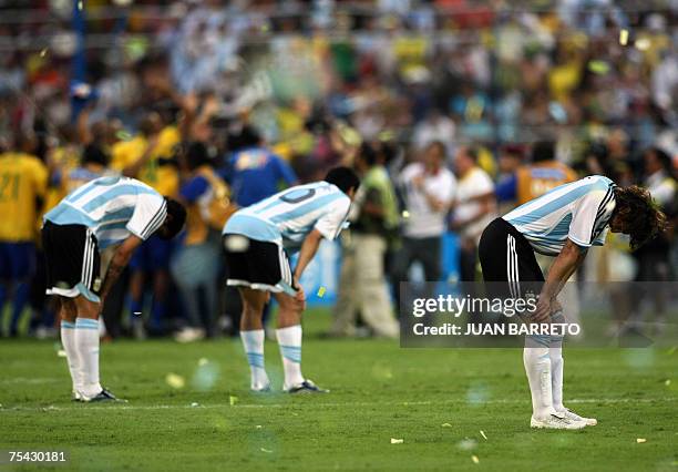 Argentina's football players Juan Roman Riquelme , defender Gabriel Heinze and Luis Gonzalez show their dejection at the end of the Copa America...