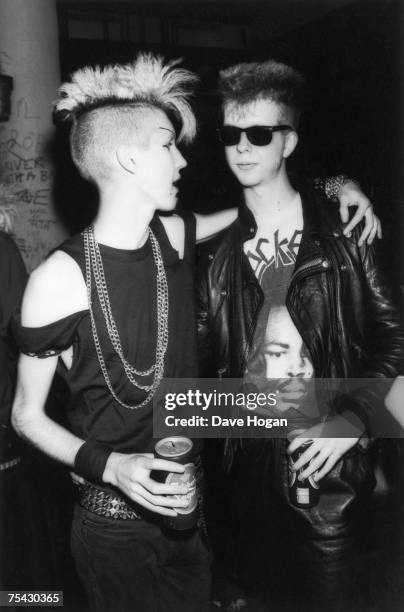 Two teenagers in punk gear at the Batcave, a seminal goth rock club in Soho, London, 1984.