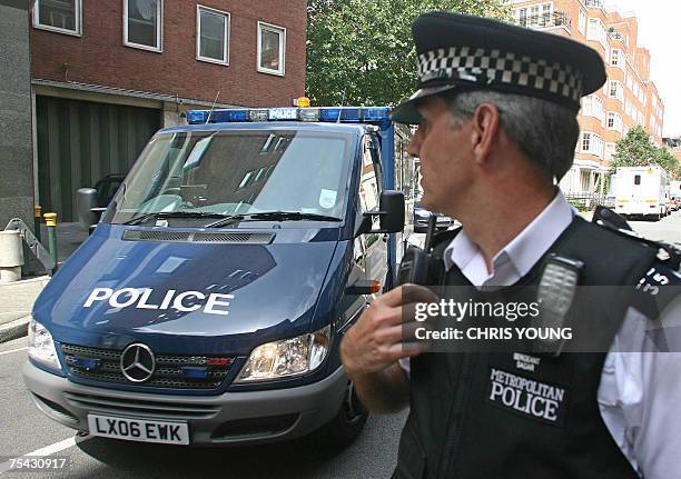 London, UNITED KINGDOM: A British police van emerges from Westminster Magistrates Court in central London, 16 July 2007, carrying Indian doctor...