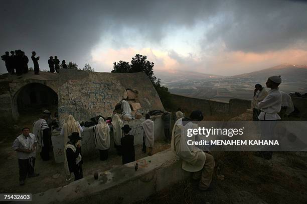 Ultra-Orthodox Jews pray at the tomb of the biblical high priest Eleazar, the son of Aaron, at Awarta Palestinian village in the northern West Bank,...