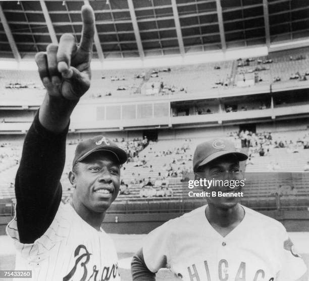 American baseball player Hank Aaron of the Atlanta Braves poses with Ernie Banks of the Chicago Cubs prior to a game, Atlanta, Georgia, May 2, 1970....