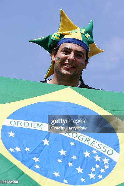 Brazilian fan Bruno Oliveira smiles during the match between Angie Akers and Brooke Niles Hanson of the United States of America and Juliana Silva...