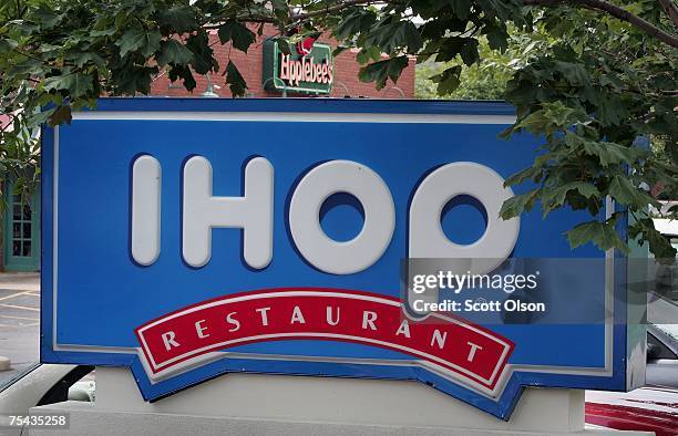 Signs mark the locations of neighboring IHOP and Applebee's restaurants July 16, 2007 in Elgin, Illinois. IHOP has agreed to purchase the Applebee's...
