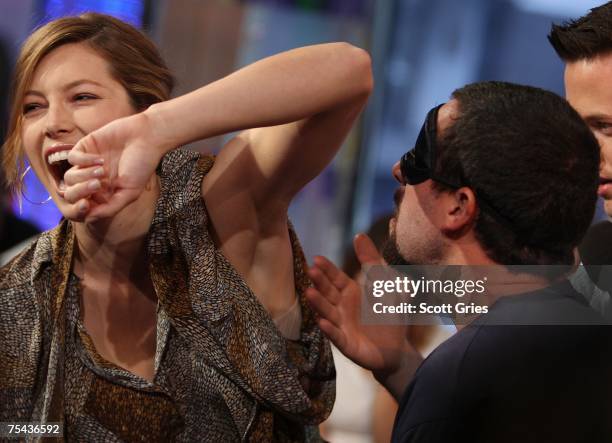 Adam Sandler sniffs Jessica Biel's armpit during MTV's Total Request Live at the MTV Times Square Studios on July 16, 2007 in New York City.