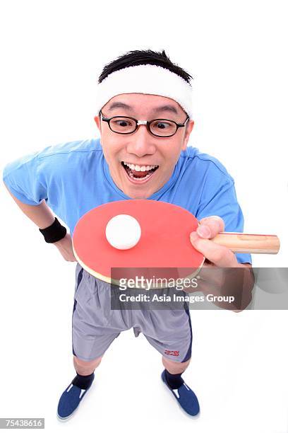 man with ping pong racket, balancing ball - funny ping pong stock pictures, royalty-free photos & images