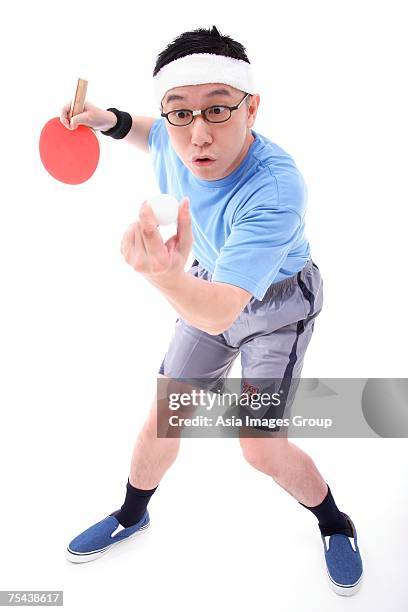 man playing ping pong, preparing to serve - funny ping pong stock-fotos und bilder