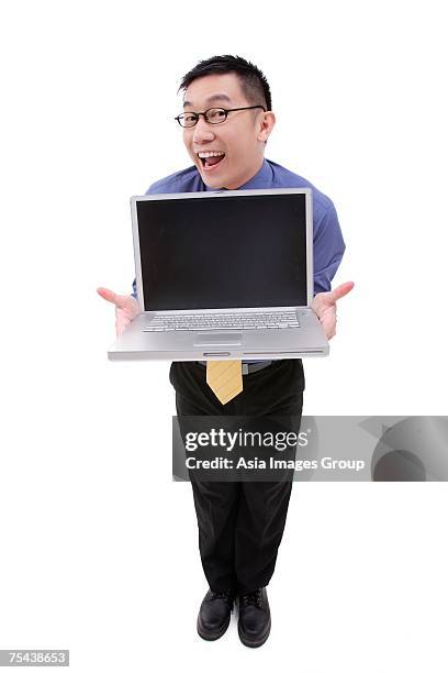 businessman with open laptop, facing camera - business person facing away from camera stockfoto's en -beelden