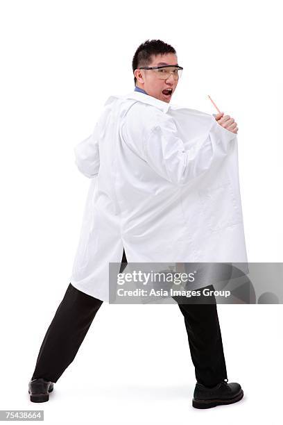 man in lab coat, looking over shoulder at camera - flash back stock pictures, royalty-free photos & images