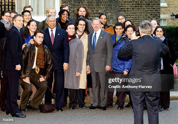 British Home Secretary Jack Straw takes a picture of students from the American school of London with U.S. Secretary of State Colin Powell, British...