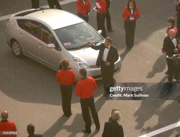 George Clooney arrives in a Toyota Prius