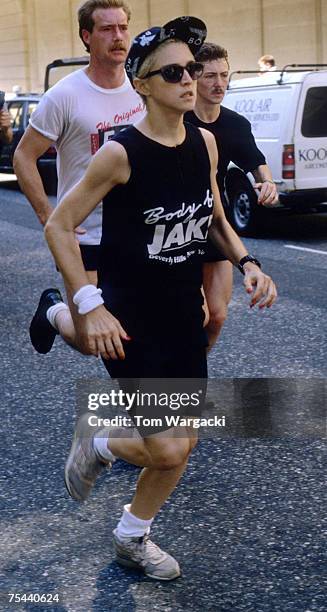 Madonna at The Mayfair Hotel jogging with bodyguards