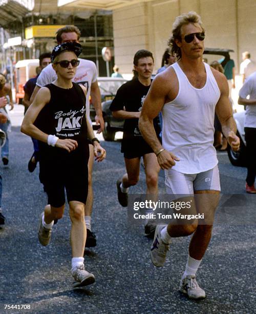 Madonna at The Mayfair Hotel jogging with personal trainer and bodyguards