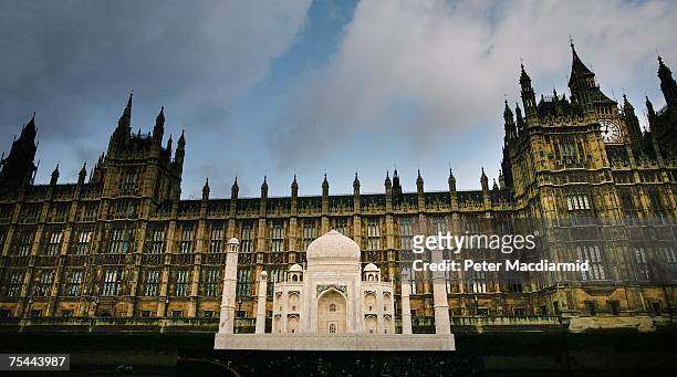 Replica of The Taj Mahal floats past Parliament on the River Thames on July 17, 2007 in London. The replica Taj is part of the India Now Festival,...