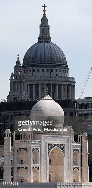 Replica of The Taj Mahal floats past St Paul's Cathedral on the River Thames on July 17, 2007 in London. The replica Taj is part of the India Now...