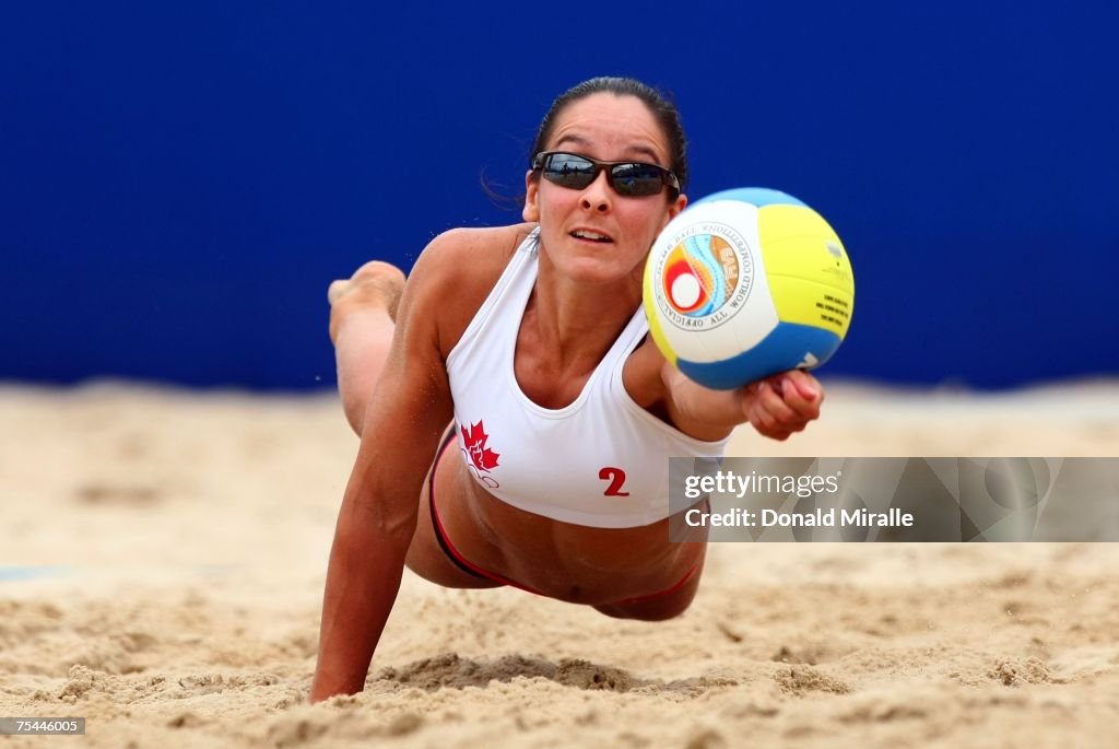 Marie Andre Lessard Marie-Andree Lessard of Canada dives to dig the ball en route to ...