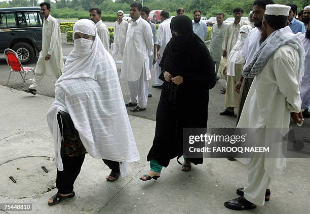 Jamila Shahid and Niala Khalid sisters of slain Pakistani radical cleric Abdul Rashid Ghazi arrive at The Sports Complex in Islamabad, 17 July...