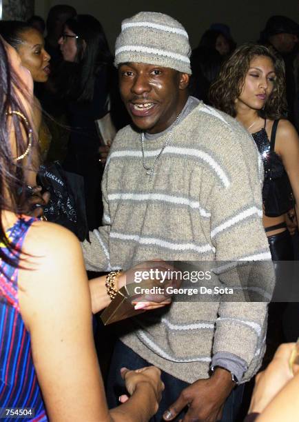 Singer Bobby Brown dances with a friend while attending the party the Sean John Fall 2001 collection February 10, 2001 at The "W" hotel in New York...