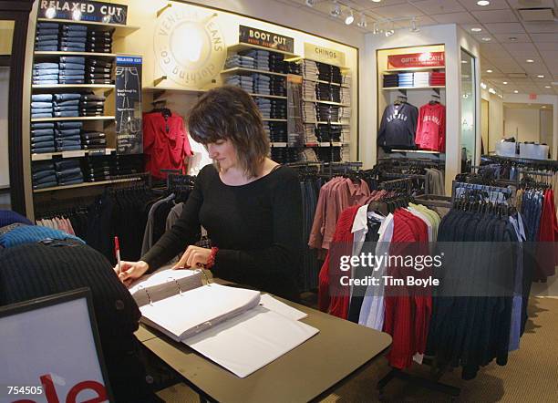 Co-sales manager Irina Krupskaya works on delivery orders in her Lane Bryant store January 3, 2002 in Skokie, IL. Founded in 1900, Lane Bryant is the...