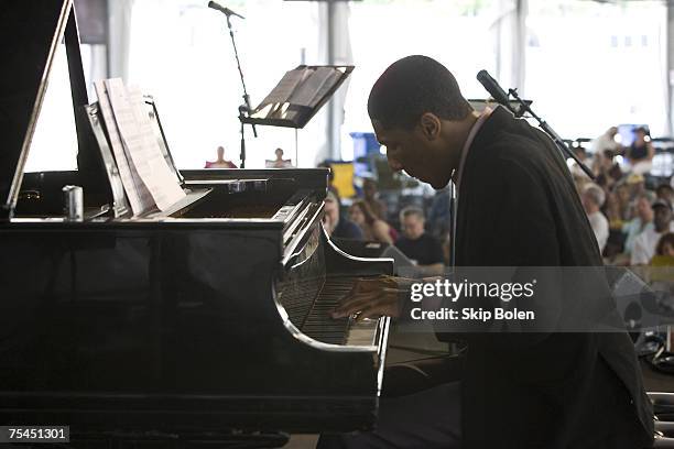 Pianist Jonathan Batiste of the Juilliard Jazz Orchestra on stage in the AT&T/WWOZ Jazz Tent at the 38th Annual New Orleans Jazz & Heritage Festival...