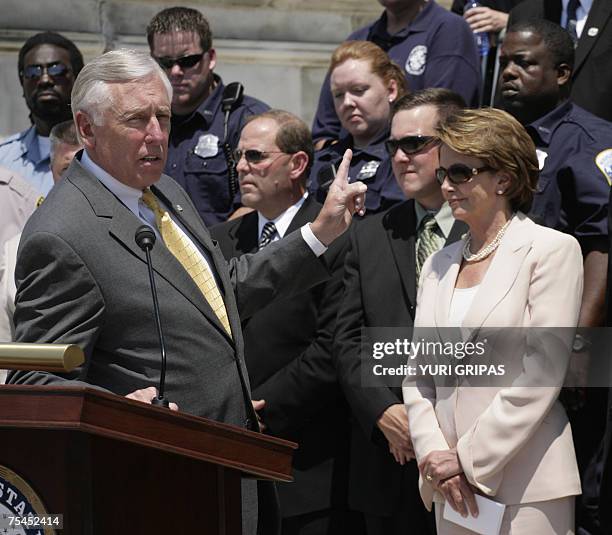 Washington, UNITED STATES: US House Speaker Nancy Pelosi listens as House Majority Leader Steny Hoyer of Maryland speaks during a news conference in...