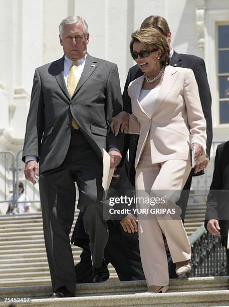 Washington, UNITED STATES: US House Speaker Nancy Pelosi and House Majority Leader Steny Hoyer of Maryland walk out for a news conference in front of...