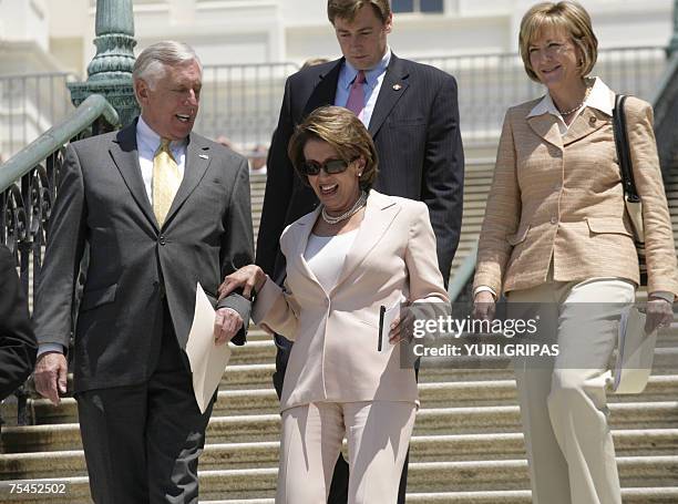 Washington, UNITED STATES: US House Speaker Nancy Pelosi and House Majority Leader Steny Hoyer of Maryland walk out for a news conference in front of...