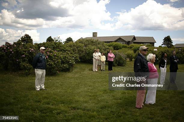 President George W. Bush and Russian President Vladamir Putin hold a joint press conference outside the main house at the Bush family house at...