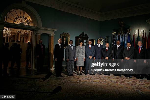 President George W. Bush poses for photographs with Caribbean leaders during the Conference on the Caribbean at the State Department on June 20, 2007...