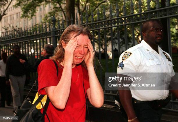 Stunned woman fleeing the scene of the terrorist attack on the World Trade Center.