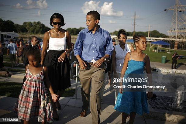 Democratic presidential hopeful Barack Obama is joined by his wife Michelle and daughters, Malia and Sasha at a Iowa Cubs minor league baseball game,...