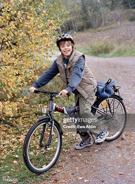 a boy with his bicycle. - teenager cycling helmet stock pictures, royalty-free photos & images