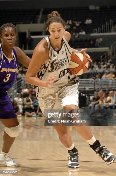 Ruth Riley of the San Antonio Silver Stars drives past Taj McWilliams-Franklin of the Los Angeles Sparks on July 17, 2007 at Staples Center in Los...