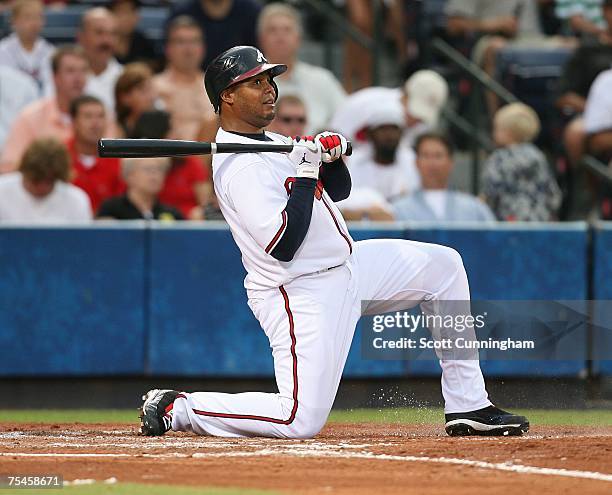 Andruw Jones of the Atlanta Braves reacts after fouling off a pitch against the Cincinnati Reds at Turner Field on July 17, 2007 in Atlanta, Georgia....