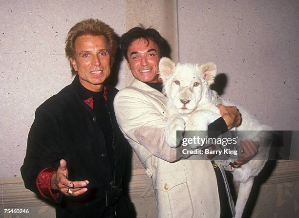 Siegfried and Roy with White Lion cub