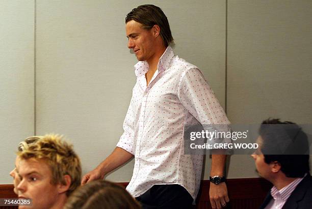 Australian tennis player Lleyton Hewitt arrives at a press conference in Sydney, 18 July 2007, to announce the appointment of Tony Roche as his new...