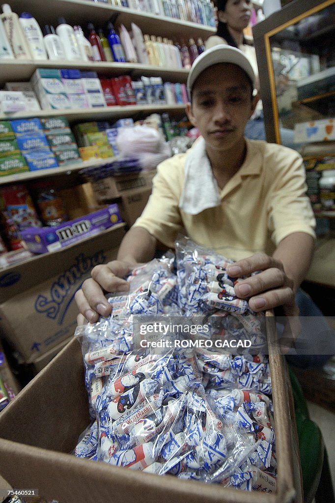 A store personnel shows a box of the pop...