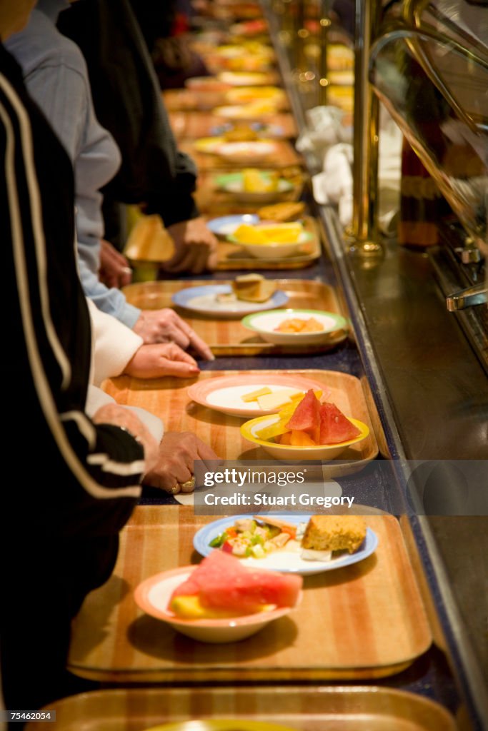 People picking up food at buffet, elevated view