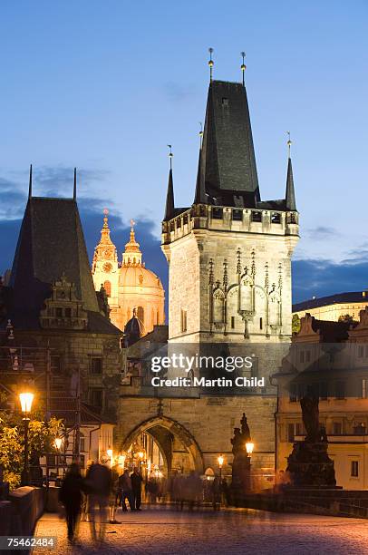 charles bridge, church of saint francis, prague, czech republic, dusk - charles bridge stock pictures, royalty-free photos & images