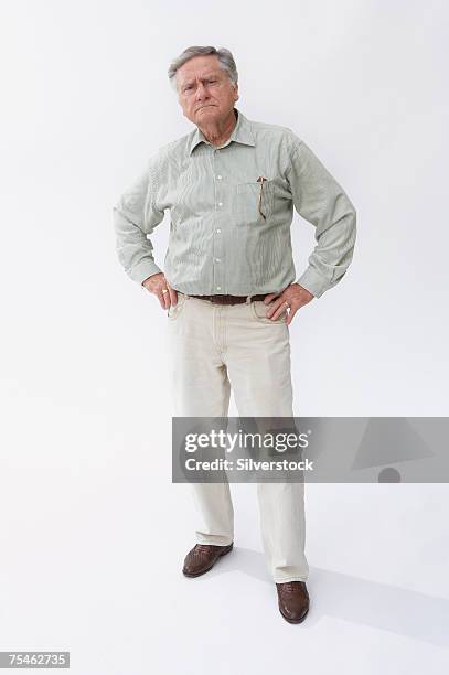 senior man with arms akimbo, portrait - man hand on hip stock pictures, royalty-free photos & images