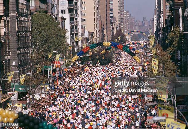 high angle view of mass of marathon runners on first avenue, new york city. new york, usa. - marathon new york stockfoto's en -beelden