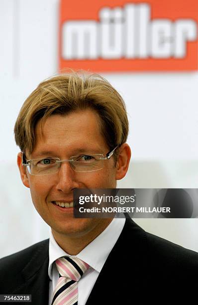 Stefan Mueller, managing director of the German milk and cheese products group Muellermilch, gives a press conference 18 July 2007 during the...