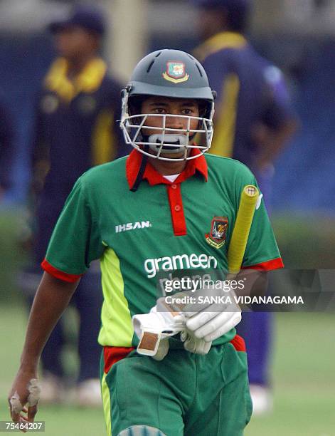 Bangladeshi cricketer Mushfiqur Rahim walks back to the pavilion after his dismissal during a practice match against a Sri Lankan Cricket...