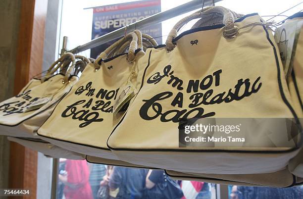 The "I'm Not a Plastic Bag" shopping totes by Anya Hindmarch are seen at a Whole Foods Market July 18, 2007 in New York City. 20,000 of the...